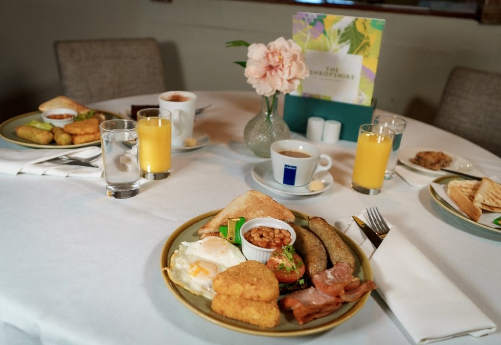 Table filled with traditional English breakfasts served at The Shropshire Golf Club in Telford, ideal for golf days, events, and morning meetings